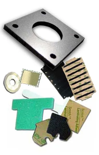 Custom adhesive spacers and insulators
